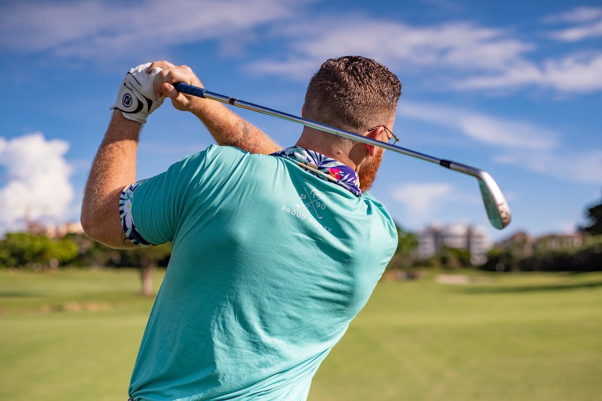 Photo of a man playing golf.