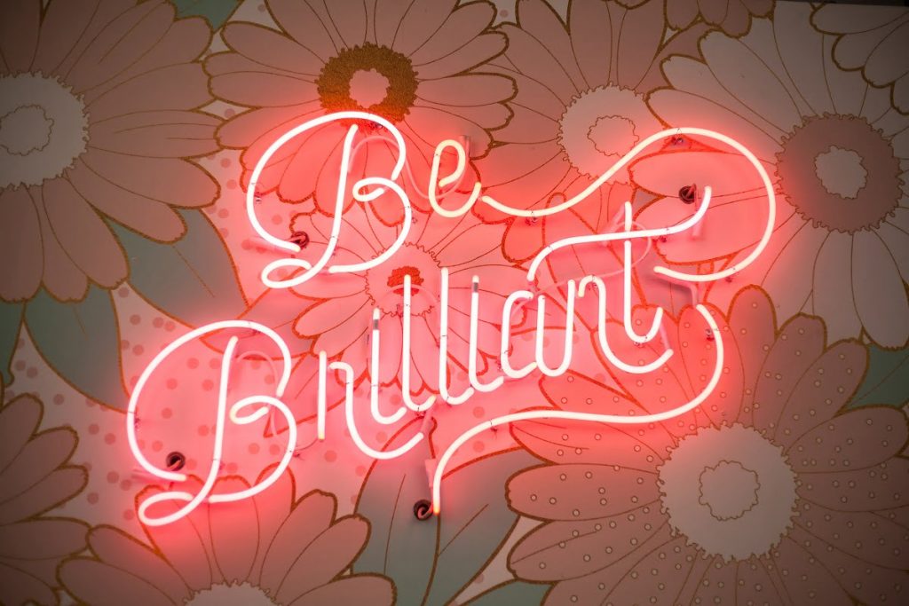 Photo of a sign saying Be Brilliant.