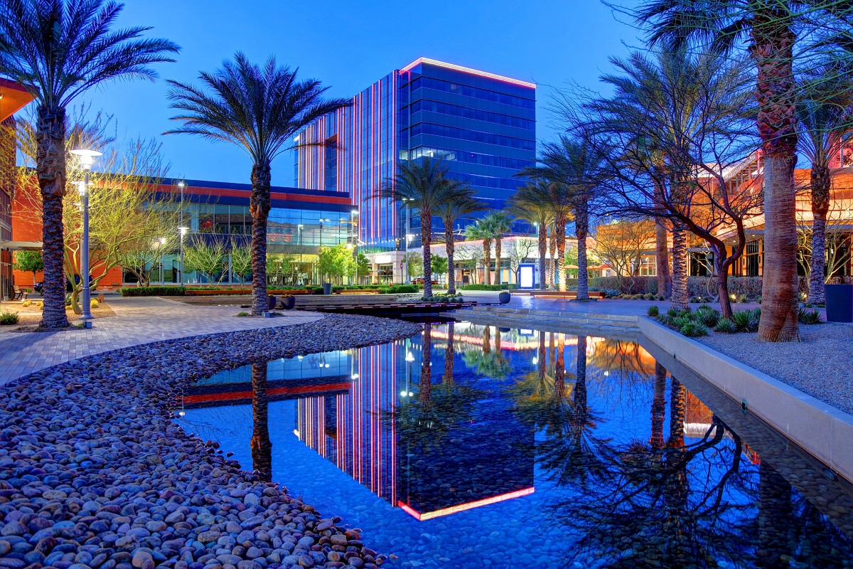 Decorative lights comes on in Downtown Summerlin as the sun sets.