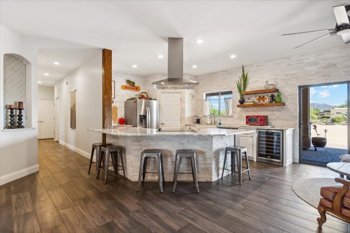 Dark wooden floors compliment a high-end kitchen.